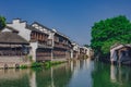 Traditional Chinese houses and trees by water, in the old town of Wuzhen, China Royalty Free Stock Photo