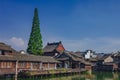 Traditional Chinese houses and trees by water, in the old town of Wuzhen, China Royalty Free Stock Photo