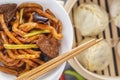 Traditional Chinese noodles with meat in soy sauce. Royalty Free Stock Photo