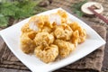 Traditional chinese plate of fried breaded squids on the table i Royalty Free Stock Photo