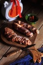 Traditional Chinese preserved sausage and pork, cut in slices in on a vintage cutting board Royalty Free Stock Photo