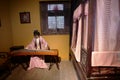 Traditional Chinese Residences mannequin woman playing guqin in the room in Tianshui Folk Arts Museum Hu Shi folk house, Gansu