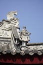 the traditional Chinese roofing edge, there are some status on it, with guardians and fish.