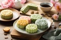 Traditional Chinese skin mooncakes for mid autumn festival with fruit, taro and matcha paste