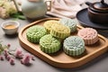 Traditional Chinese skin mooncakes for mid autumn festival with fruit, taro and matcha paste