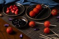 Traditional chinese snack called Tanghulu meaning crispy sugar-coated fruits,tomato,strawberry,blueberry,pear and usually shows on Royalty Free Stock Photo