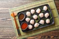 Traditional chinese steamed dumplings Dim Sums Har gow with shrimp served with sauce closeup. Horizontal top view Royalty Free Stock Photo