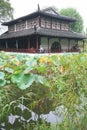 Traditional Chinese summer house and lotus plants