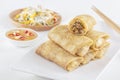 Traditional Chinese tortillas filled - bings in a plate on a white background, salads, Dam Sam snacks.