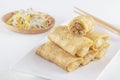 Traditional Chinese tortillas filled - bings in a plate on a white background, salads, Dam Sam snacks.