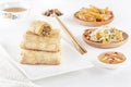 Traditional Chinese tortillas filled - bings in a plate on a white background, salads, Dam Sam snacks