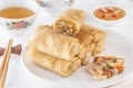 Traditional Chinese tortillas filled - bings in a plate on a white background, salads, Dam Sam snacks