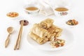 Traditional Chinese tortillas filled - bings in a plate on a white background, salads, Dam Sam snacks and cup