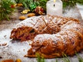 Traditional Christmas cake with dried fruits, raisins and nuts on wooden background. Royalty Free Stock Photo