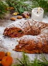 Traditional Christmas cake with dried fruits, raisins and nuts on wooden background. Royalty Free Stock Photo