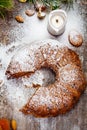 Traditional Christmas cake with dried fruits, raisins and nuts on wooden background. Top view Royalty Free Stock Photo