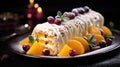 A traditional Christmas cake with orange colored fruits and white cream