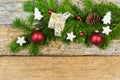 Christmas decoration with fir branch, gift box and ornaments on wood Royalty Free Stock Photo