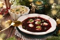 Traditional Christmas Eve red borscht with dumplings filled with mushrooms and sauerkraut Royalty Free Stock Photo