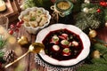 Traditional Christmas Eve red borscht with dumplings filled with mushrooms and sauerkraut top view Royalty Free Stock Photo