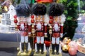 Traditional Christmas holiday nutcrackers figurine ornament. Wooden nutcrackers as a Christmas window installation