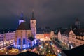 The traditional famous Christmas market on the Neupfarrplatz in Regensburg in December seen from roof terrace at night