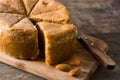 Traditional Christmas marzipan slice on wooden table. Royalty Free Stock Photo