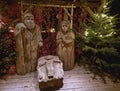 Traditional Christmas nativity scene with figures made out of wood, the birth of Jesus Christ in the manger surrounded by Joseph Royalty Free Stock Photo