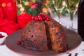 Traditional Christmas pudding with holly on top Royalty Free Stock Photo