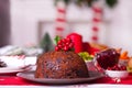 Traditional Christmas pudding with holly on top Royalty Free Stock Photo