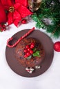 Traditional Christmas pudding with holly on top Royalty Free Stock Photo