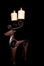 Traditional Christmas reindeer candlestick holder with beautiful lit candles Royalty Free Stock Photo
