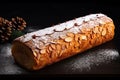 Traditional Christmas sponge roll, Buche de Noel. On a dark background.