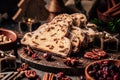 Traditional christmas stollen fruit cake with cookies on festive table Royalty Free Stock Photo
