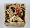 traditional Christmas straw decorations in a wicker box