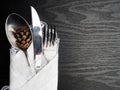 Traditional Christmas table place setting, cutlery, white ruffled napkin, pine cone. Holidays background. Flat lay, top view with Royalty Free Stock Photo