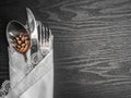 Traditional Christmas table place setting, cutlery, white ruffled napkin, pine cone. Holidays background. Flat lay, top view with Royalty Free Stock Photo