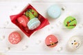 Traditional christmas themed french macaroons sweets in the form of snowman, snowflake, christmas tree and santa`s belly with can Royalty Free Stock Photo