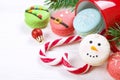 Traditional christmas themed french macaroons sweets in the form of snowman, snowflake, christmas tree and santa`s belly with cand Royalty Free Stock Photo