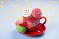 Traditional christmas themed french macaroons sweets in the form of snowman, snowflake, christmas tree and santa`s belly with can Royalty Free Stock Photo