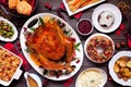 Traditional Christmas turkey dinner. Top view table scene on a dark wood background. Royalty Free Stock Photo