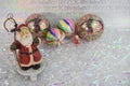 Christmas photography image of Santa Claus ornament stocking holder and bright colored tree decorations in background Royalty Free Stock Photo