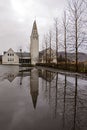 Traditional church near lake in Iceland. Icelandic church with t