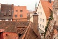 Traditional cityscape view. Old City with tile roofs, chimney and historical stone buildings in Germany