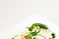 Traditional classic Shopska salad with tomatoes, peppers, cucumbers and cheese in white dish on white wooden table. Bulgarian cuis Royalty Free Stock Photo