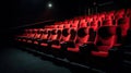 Traditional classically regal ornate rounded wood armed formal plush deep red velvet opera movie theater chairs in Royalty Free Stock Photo