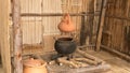 traditional clay pot on charcoal stove Royalty Free Stock Photo