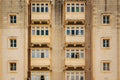 Traditional closed wooden balconies of Valletta city in Malta Royalty Free Stock Photo