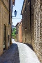 Traditional cobblestone street with old buildings lining the road in the Republic of San Marino