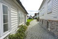 Traditional cobblestone street with wooden houses in the old town of Stavanger, Norway